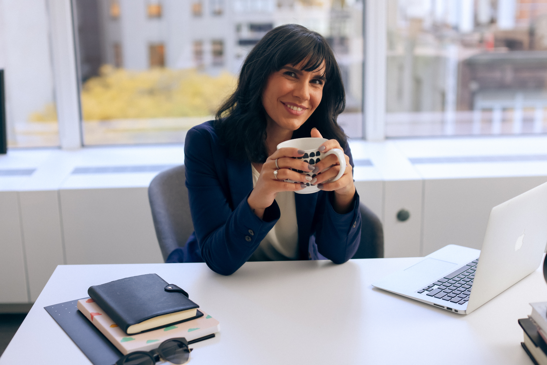Editorial — at desk with coffee
