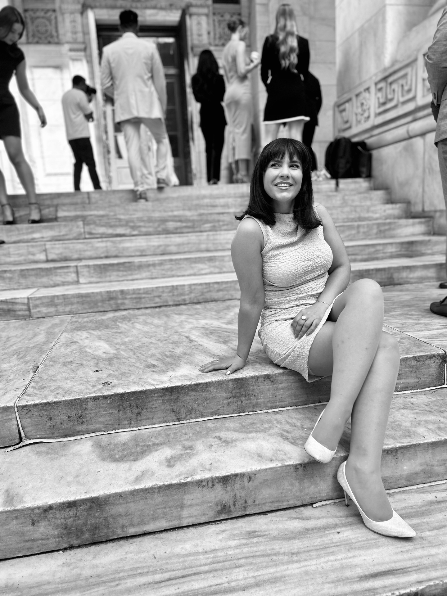 Cinematic — black and white on library steps